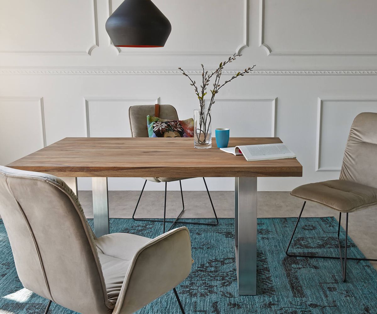 Four seater dining table made of solid sheesham wood and iron