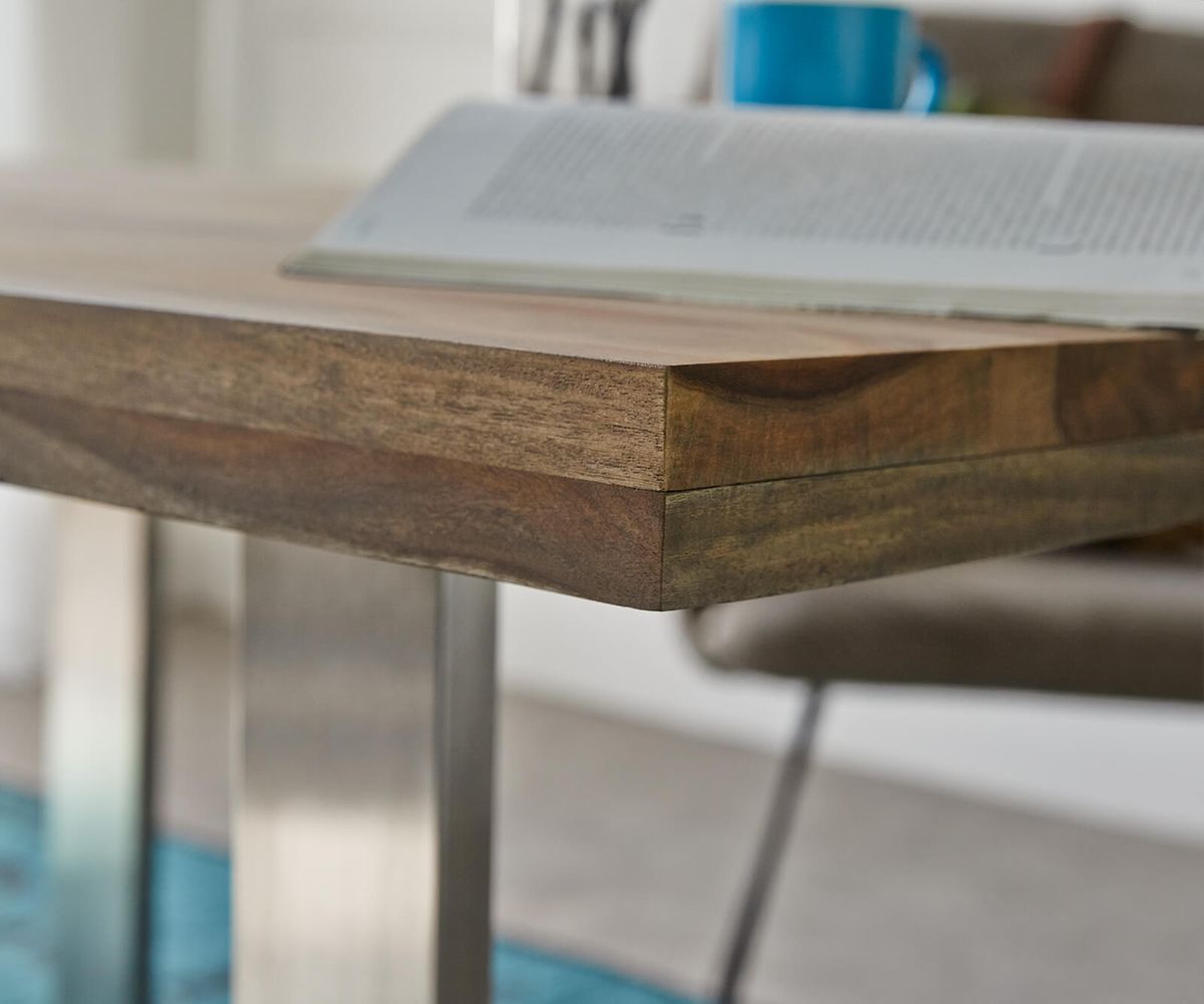 Four seater dining table made of solid sheesham wood and iron